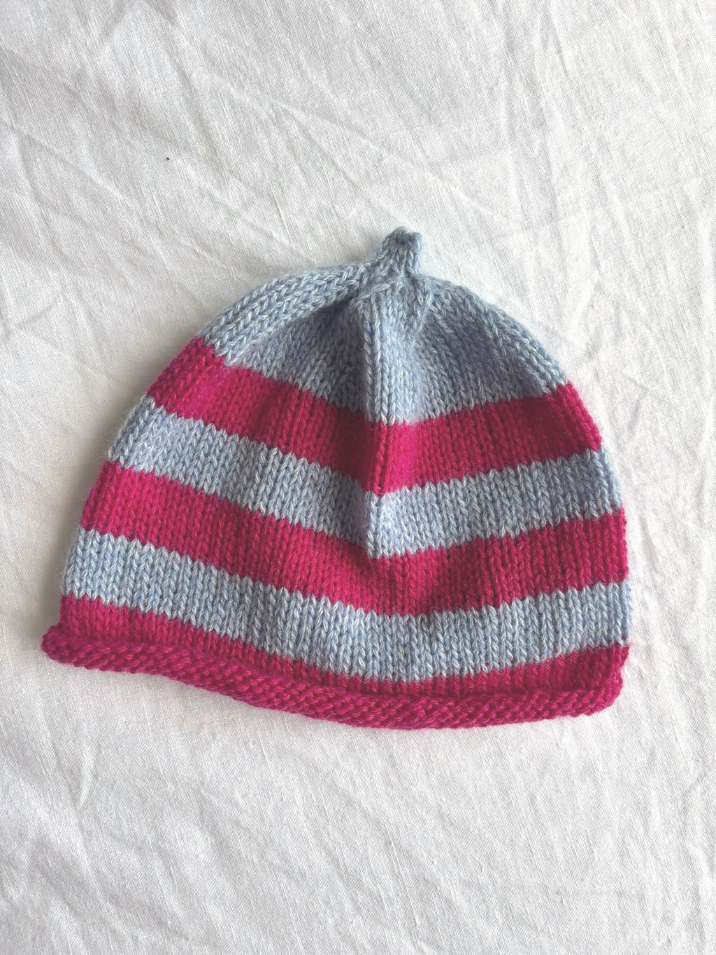 Godis in baby blue and pink, hand-knitted cashmere baby hat