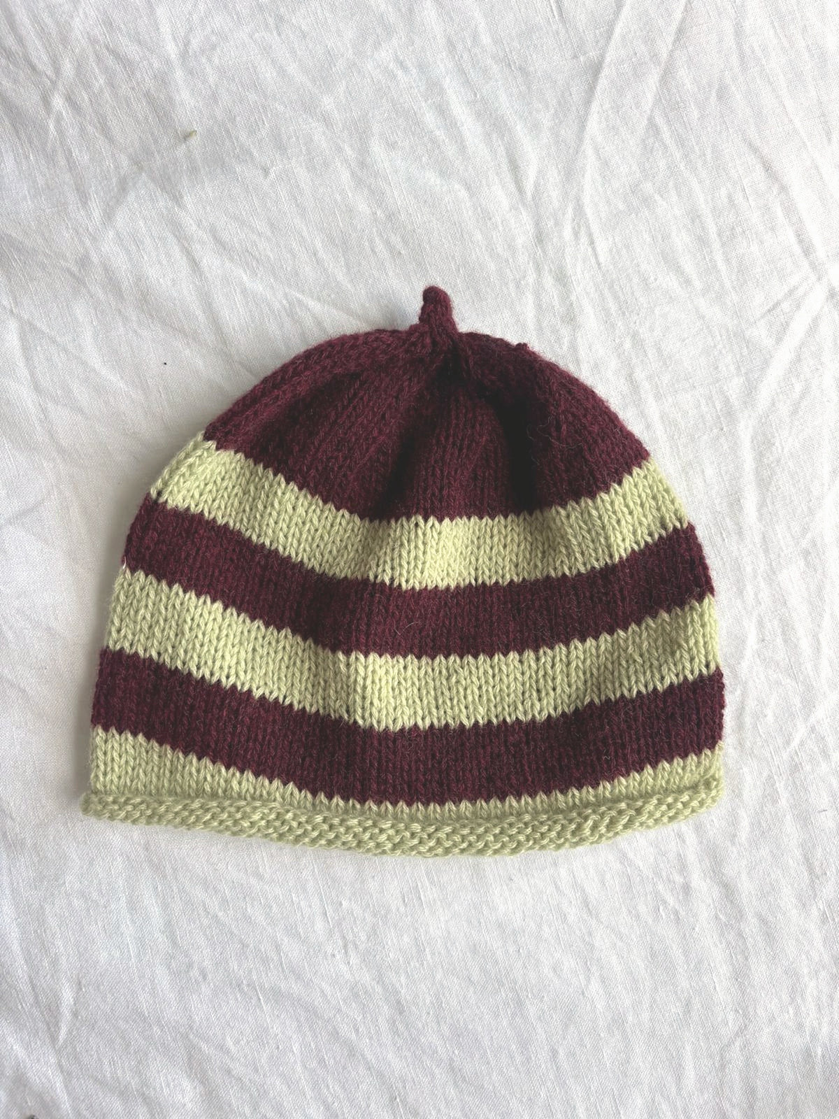 Godis in burgundy and lime, hand-knitted cashmere baby hat