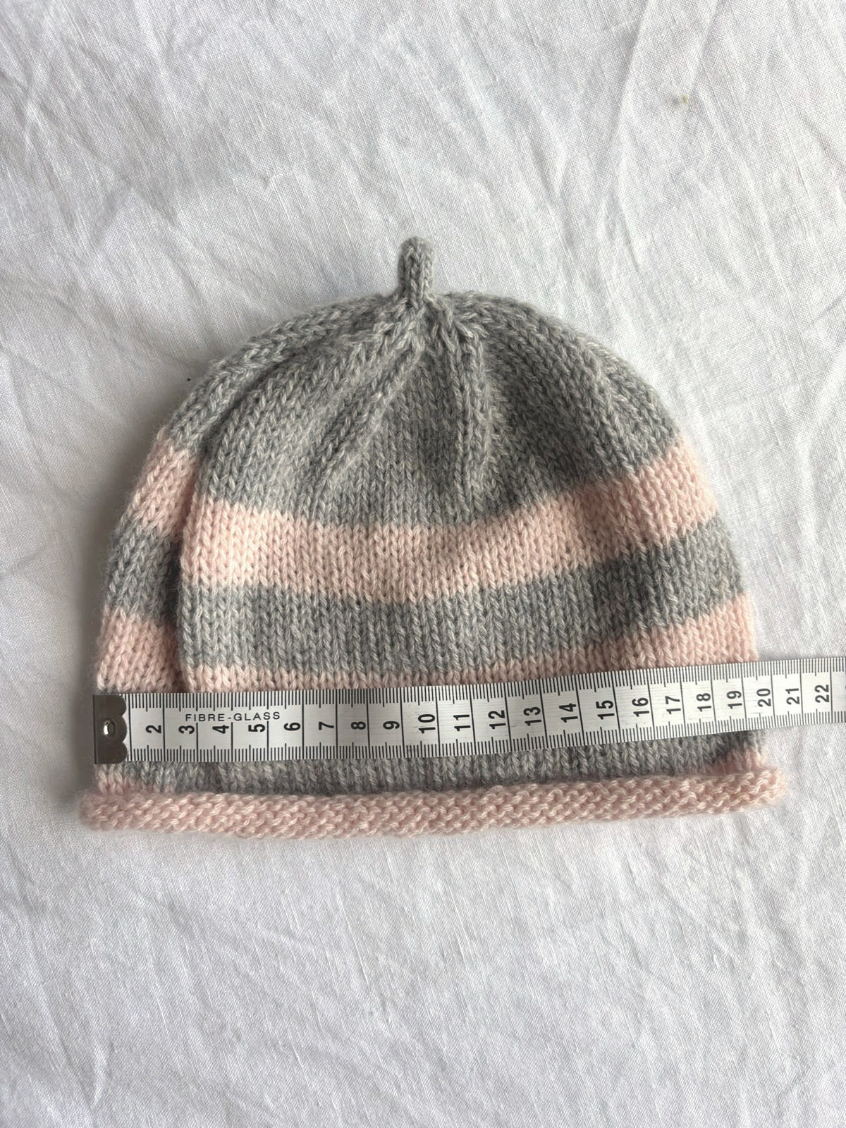 Godis in grey and blush, hand-knitted cashmere baby hat