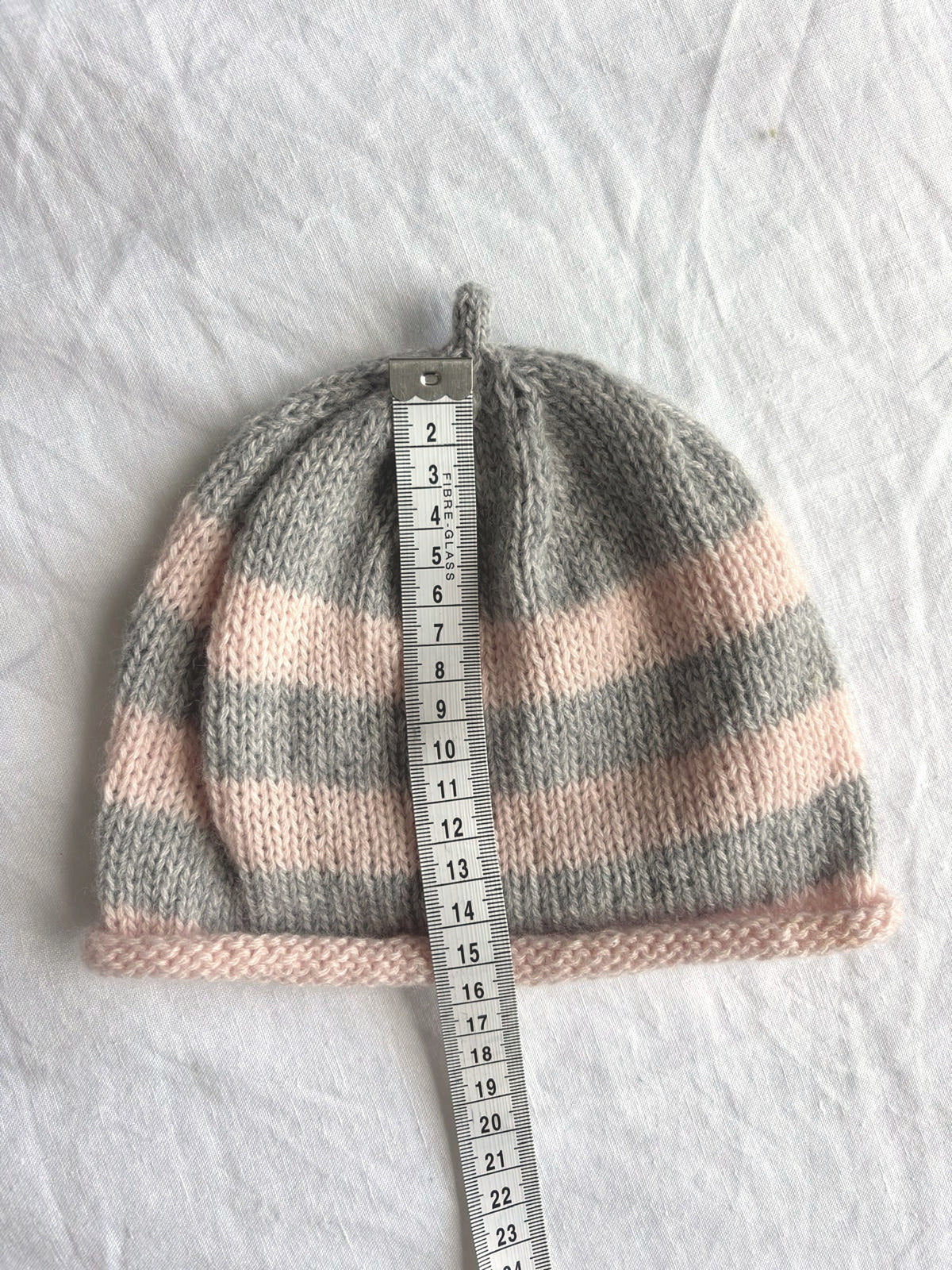 Godis in grey and blush, hand-knitted cashmere baby hat