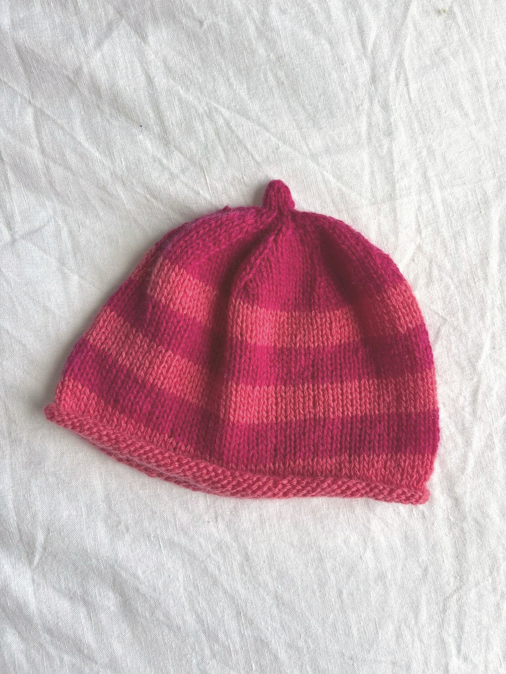 Godis in raspberry and coral, hand-knitted cashmere baby hat